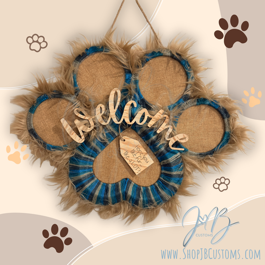 Decorative wreath with paw prints and 'Welcome' text on a beige background